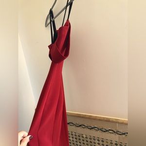 Red midi bodycon dress with off the shoulder details.